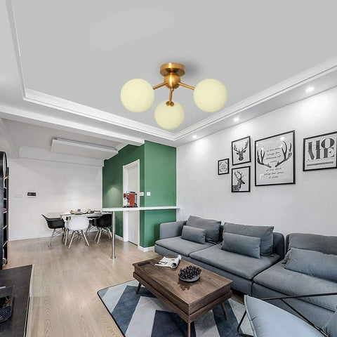 3 Light Modern Globe Ceiling Light Mid Century Sputnik Chandelier With White Glass Shades Brushed Brass Finish Semi Flush Mount in living room