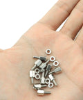 Hand holding 50Pcs Brass Hex Standoff Spacers With Nuts 4-40 Thread 6mm Long Hex Studs for PC rig mounting, nickel plated copper kit