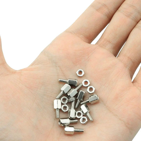 Hand holding 50Pcs Brass Hex Standoff Spacers With Nuts 4-40 Thread 6mm Long Hex Studs for PC rig mounting, nickel plated copper kit