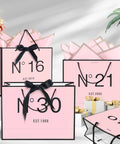 13 Inch Birthday Gift Bag Set With Card Envelope Ribbon Bow And Tissue Paper For Women And Girls Handles Includes Greeting Card Milestones From 13th To 100th in pink and black design
