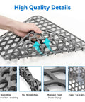 Person holding 2 Pack Silicone Sink Mats Dope Non Slip Foldable Grids For Kitchen Sinks, heat resistant food grade, gray color focus.