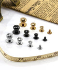 Badass Chicago Screws And Button Head Stud Rivets Sweet Top Tier Fasteners For Leathercraft Diy Crafts Featuring 50 Black Zinc Alloy Pieces, showcasing various sizes and finishes on a measuring tape.