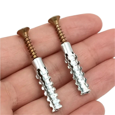 Self Drilling Drywall Anchor Screws Kit 150pcs With Yellow Zinc Plated Carbon Steel Expansion Tubes Easy No Prep Install Built Tough Wall Mounts For DIY Projects, two anchors in hand