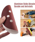 Super Smooth Results With 200 Pcs Of 5 Inch Sanding Discs Featuring Hook Loop Backing And Dust Vent Holes For Orbital Sanders In 40 To 180 Grit Sizes Ready For Any DIY Project Today, showing a hand holding a sanding disc.