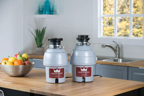 Two Waste King garbage disposals on kitchen counter. High Speed Kitchen Garbage Disposal With Power Cord Food Waste Disposer 2700 RPM 115V Motor Sound Insulated EZ Mount For Quick Install Removable Splash Guard Easy Cleaning.