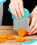 Front view: waffle fry cutter with turquoise handle and protective cover; stainless steel crinkle blade.