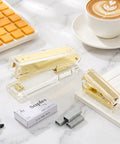 Gold Desk Stapler Set With Acrylic Finish, 20 Sheet Capacity, Includes Staple Remover And 1000 26 By 6 Staples on marble desk