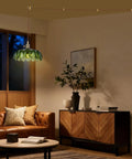 Kick Up Any Room Vintage Green Flower Glass Pendant Light With Long Plug In Cord For Kitchen Island And Bedroom Swinging Gold Tone Ceiling Lamp Fixture Adding Sweet Retro Vibes As A True Living Room Showpiece hanging above a brown leather couch.