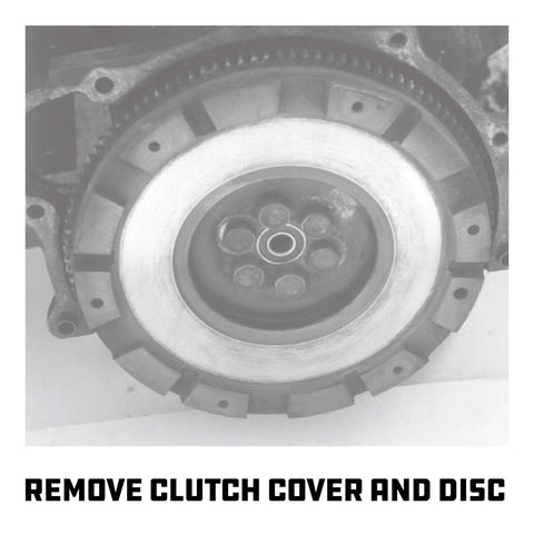 Front view of a silver steel automotive clutch pressure plate with central bearing hub