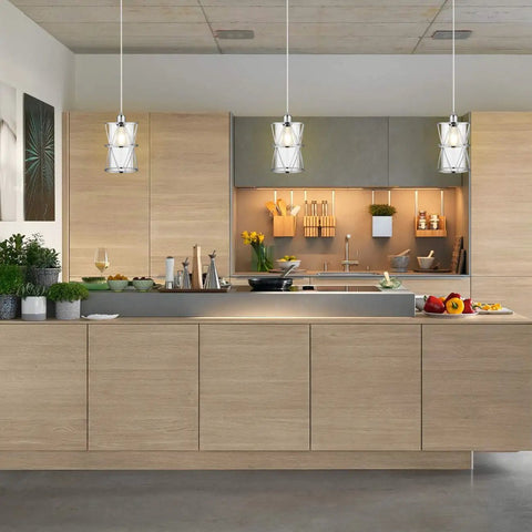 Modern Cylindrical Pendant Light With Dual Shade In Brushed Nickel And Clear Glass For Kitchen Island Sink Dining Room Bar And Foyer Sleek Industrial Style Lighting For Modern Kitchens And Dining Areas installed over kitchen island.