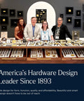 Display of hardware designs with four people standing behind a counter showcasing various cabinet knobs and handles.