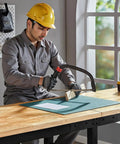 Worker using adjustable heavy duty workbench with four AC outlets and two USB ports, 2000 lbs capacity, rubber wood top
