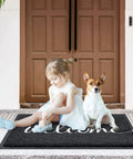 Child and dog on Black Door Mat For Entryway And High Traffic Areas, Non Slip Indoor Outdoor Welcome Mat With Low Profile Design