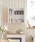 Space Saving Wall Cabinet For Bathroom Kitchen And Laundry With Enclosed Doors Adjustable Shelf And Three Height Options Over Toilet Storage White Finish A Versatile Wall Organizer For Home Garage showing open shelving with jars and dishes in a kitchen setting.