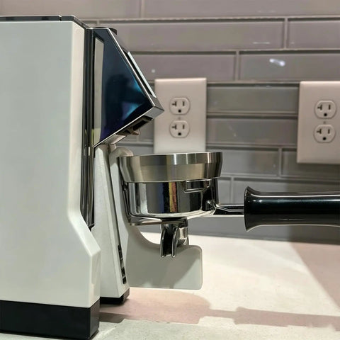 Heavy Duty Portafilter Stand Holder for Coffee Grinder Accessories keeps espresso counter clean and tidy next to a coffee grinder.