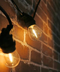 Shatterproof LED String Lights For Indoor Outdoor Use Waterproof And Weatherproof Cozy Warm White 2200K 70LM Output on brick wall