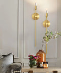 Sleek Gold Wall Candle Sconces Set Of Two Large 23 Inch Modern Light Fixtures For Bedroom Dining Room And Living Room Chic Home Decor That Delivers Major Flex Ambiance Always, displayed on a wall with decor.