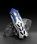 Dual Blade Pocket Knife For Everyday Carry And Camping with aluminum handle on rock background