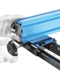 14 Inch Bandsaw Fence Fits Jet Delta General Grizzly And More Heavy Duty Precision Alignment With T Slots For Stops Easy Mount Upgrade Your Rips And Jogs Beefy Steel Construction, close-up of blue aluminum fence with gloved hands adjusting knob, detailed view of T-slot and ruler guide.