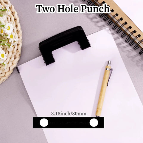 Beast Of A Two Hole Paper Punch One Quarter Inch Low Effort Double Hole Punch shown punching paper on a desk with a pen