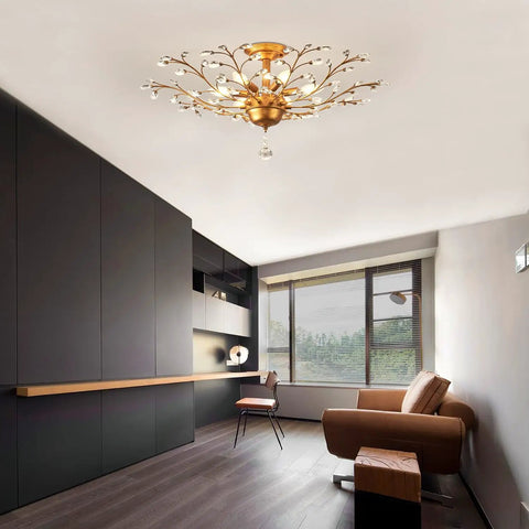 Six Light Crystal Chandelier In Golden Vintage Finish With E12 Edison Style Bulbs in a modern living room setting