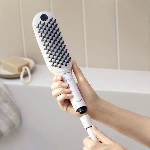 DogShower 150 3-Jet Handheld Dog Bath Bundle With Hose White 1.75 GPM Easy Grip in hand, showing ergonomic design