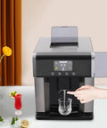 Dual Action Countertop Ice Maker And On Tap Cold Water Dispenser With Smooth Lcd Controls For Rapid Bullet Cube Crafting being used to dispense water into a glass.