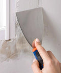 Applying Fiberglass Mesh Drywall Tape Self Adhesive Patch Roll 1.97 Inch By 150 Feet For Wall Ceiling Crack Repair near window
