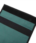 Close-up of Foldable Garden Kneeler Pouch With Handle Portable Tool Bag's fabric detailing in green and black.