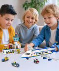Children playing with Six In One City Airport Airplane Building Set With 886 Pieces For STEM Learning, includes airplane and terminal.