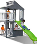 Children playing on a 2-Story Cedar Outdoor Playhouse With 8ft Slide, Working Door, Play Kitchen in Gray Scandinavian Spruce