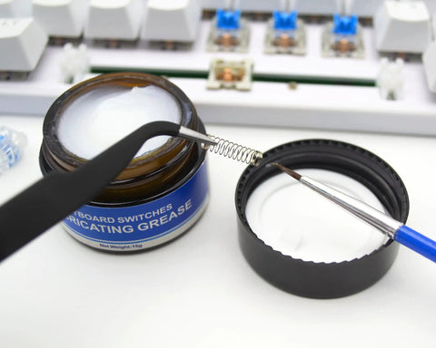 Aluminum Switch Opener And Lube Kit For Custom Keyboards With Tweezers And Four Claw Gripper shown with lubricating grease jar
