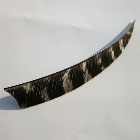 Close-up of a single black and white Shield Cut Turkey Feather Archery Fletches Pro Grade 3in for DIY hunting arrows.