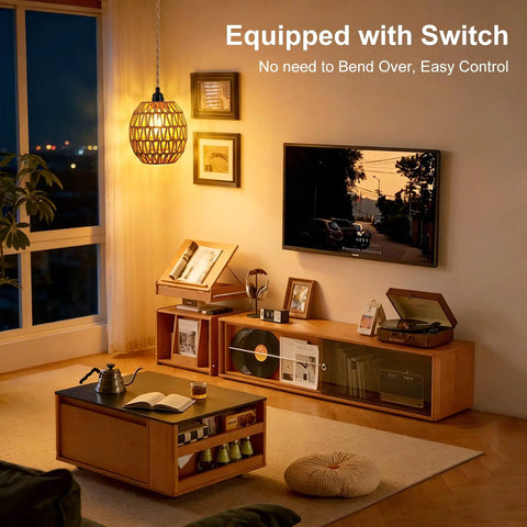 Homebody Essential Plug In Pendant Light Featuring Hand Woven Rattan And Wicker Egg Shade With 15 Ft Cord illuminating cozy living room.