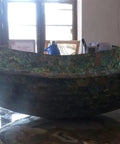 Top Shelf Oval Marble Vessel Sink With Real Abalone Shell Detailing And 24 By 19 Inch Bathroom Basin that showcases its glossy finish on a counter.