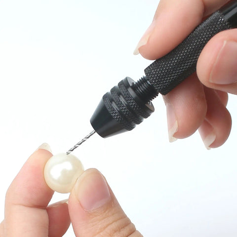 Using Pro Grade 61 Piece Pin Vise Drill Set With 50 Micro Twist Bits 1 To 3mm on pearl for precise small drilling in craft projects