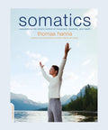 Book cover of 'somatics' by Thomas Hanna, featuring a person stretching by a lake to reawaken your mind body connection with simple body techniques.