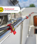 Quick Straps Assorted 12 Pack Black Heavy Duty Hook And Loop Hose And Cable Organizers securing cables on a boat rail