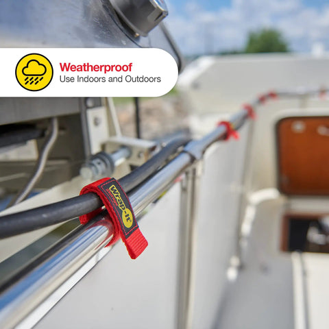 Quick Straps Assorted 12 Pack Black Heavy Duty Hook And Loop Hose And Cable Organizers securing cables on a boat rail