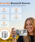 Woman using Phone Camera Grip With Selfie Stick Tripod Magnetic Mount And Detachable Wireless Shutter Button outdoors