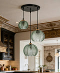 Modern 3-Light Hand-Blown Green Glass Pendant Lighting Chandelier For Kitchen Island And Dining Room with ribbed shades.
