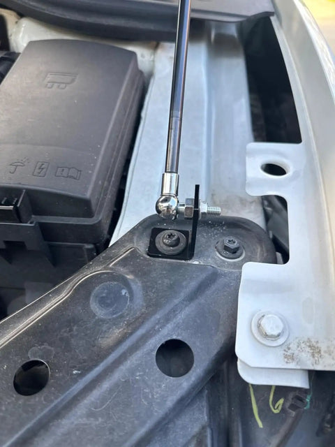 Close-up of Beefed-Up Front Hood Lift Struts For Jetta MK7 2019-2025 installed on car chassis
