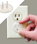 Baby Safe Outlet Covers 36 Pack For Easy Home Protection being placed into electrical socket, demonstrating durable childproofing.
