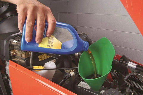Flexible Shapeable Funnel For Any Job, Reusable Silicone Pouring Tool in use for adding oil to vehicle engine.