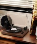 Bluetooth Turntable Player With Built In Phono Preamp And Magnetic Cartridge Belt Drive Records Player 2 Speed Vinyl Record Deck on a wooden table.