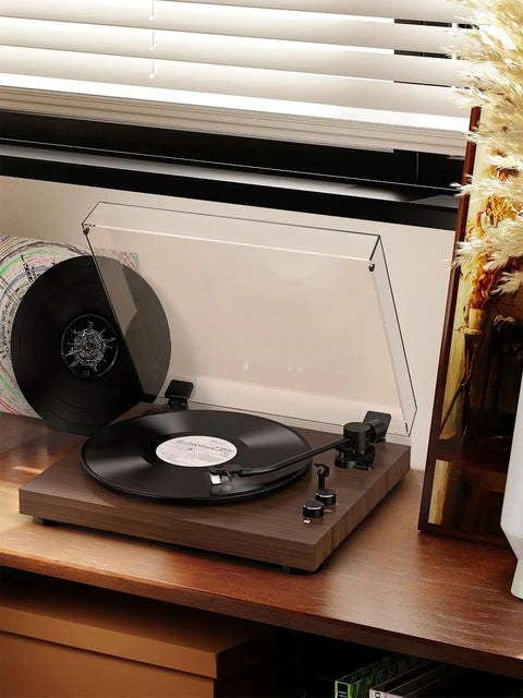 Bluetooth Turntable Player With Built In Phono Preamp And Magnetic Cartridge Belt Drive Records Player 2 Speed Vinyl Record Deck on a wooden table.