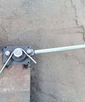 Heavy Duty Rebar And Rod Bender For Metalworking installed on concrete, with handle extended for bending steel rods up to 5/8 inch
