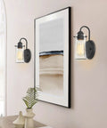 Rayne 9.5 Inch Modern Farmhouse Wall Sconce Black Gooseneck Light With Tapered Seeded Glass Shade Matte Black Finish in hallway