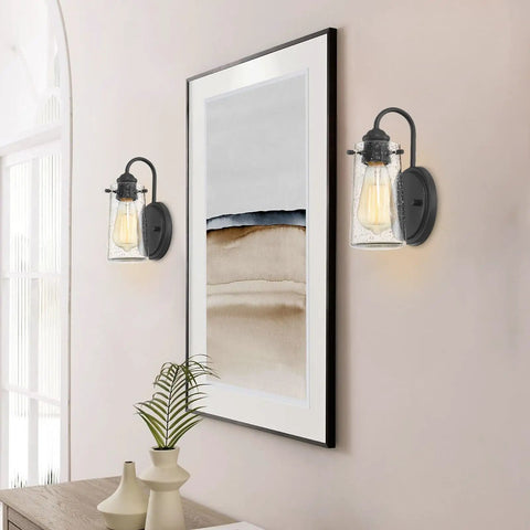 Rayne 9.5 Inch Modern Farmhouse Wall Sconce Black Gooseneck Light With Tapered Seeded Glass Shade Matte Black Finish in hallway