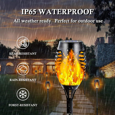 Image of 12-Pack Solar Christmas Lights Outdoor With Flickering Flame Tiki Torches Waterproof Garden Lights in the rain, highlighting IP65 waterproof feature.